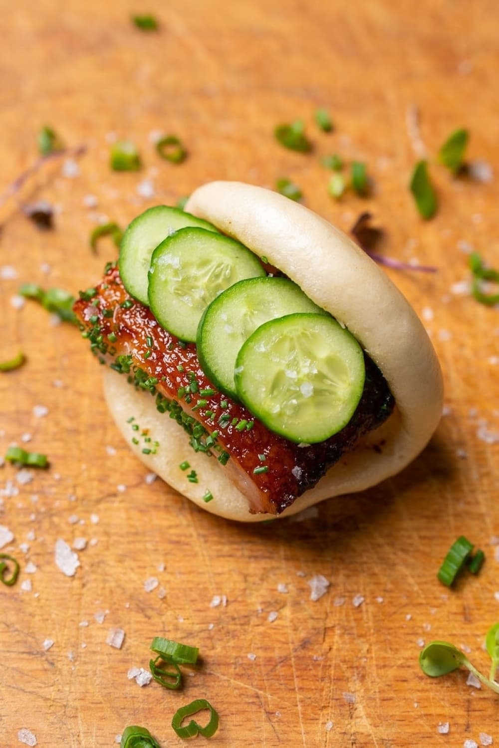Short rib and cucumber sandwich in a bun