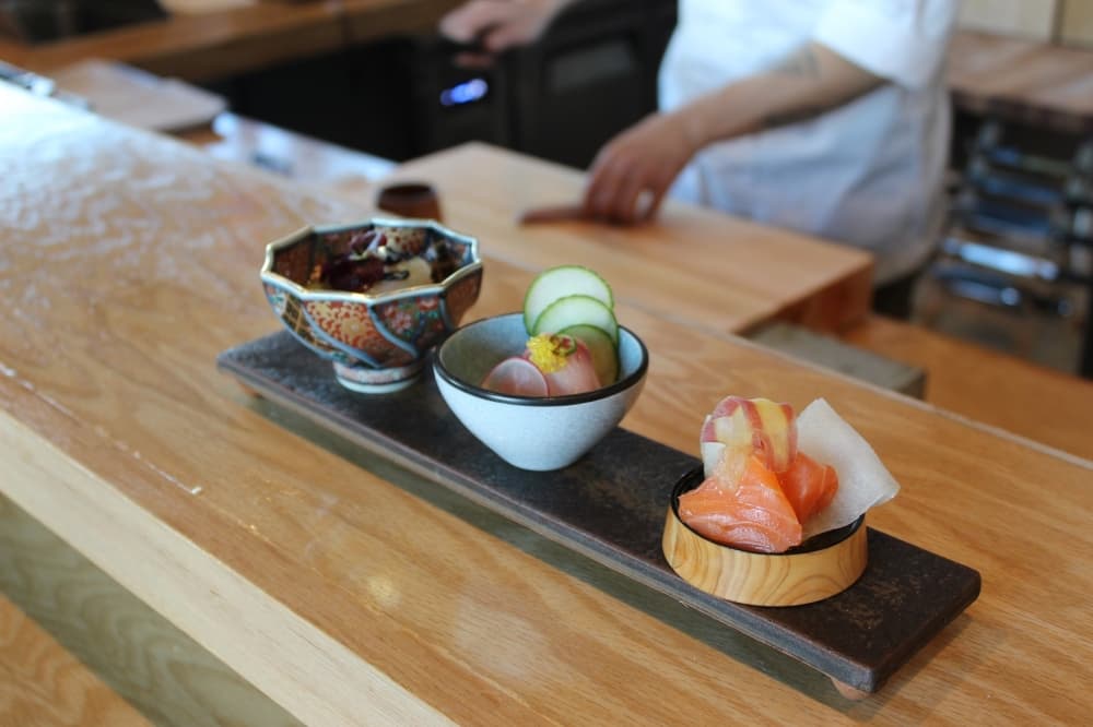 Kinzo's santenmori serving features three signature cold dishes from the restaurant's menu. (Colby Farr/Community Impact)