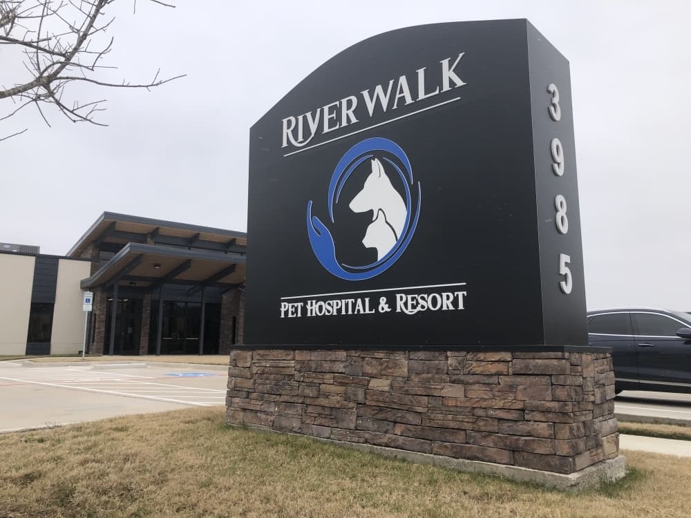 A sign that reads Riverwalk