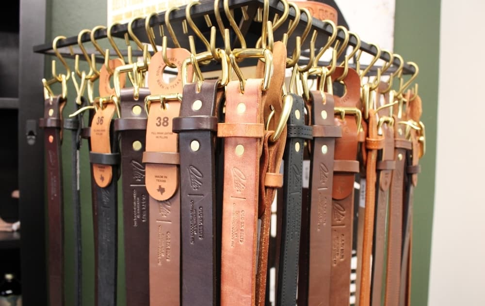 Belts hanging in a store. 