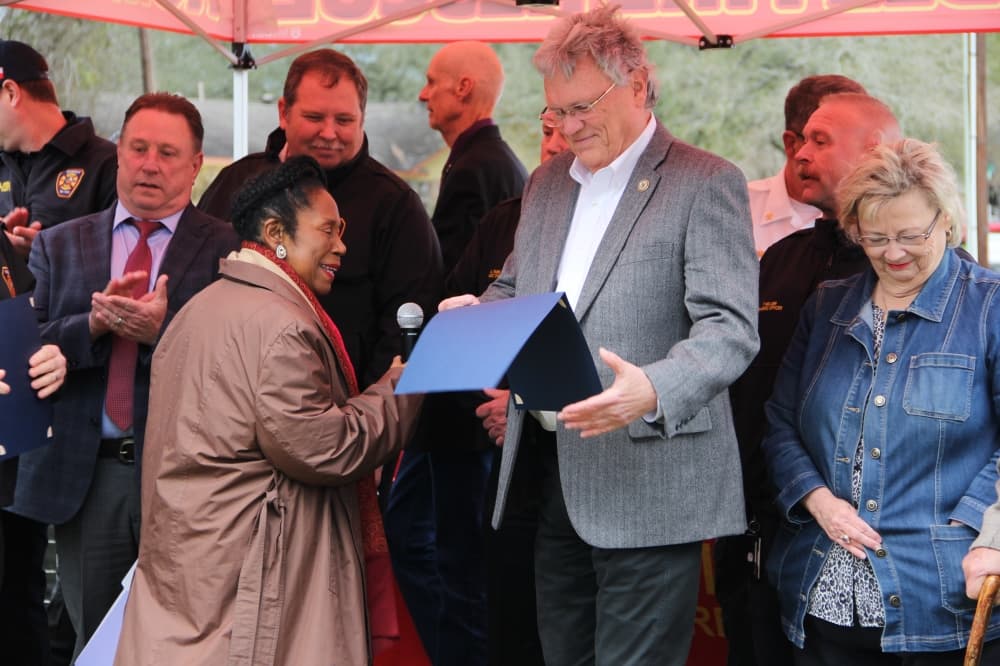 Rep. Sheila Jackson Lee, D-Houston, presents Humble Mayor Norman Funderburk with a certificate of congressional recognition during the city's Jan. 20 groundbreaking ceremony for Humble Fire Station No. 2. (Wesley Gardner/Community Impact)