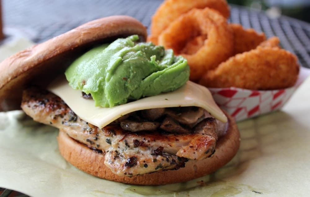 JG’s Special Chicken Sandwich basket ($15.41) can have mushrooms and Swiss cheese added. It is served with onion rings. (Karen Chaney/Community Impact)