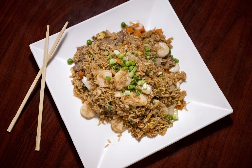fried rice on place with chopsticks 