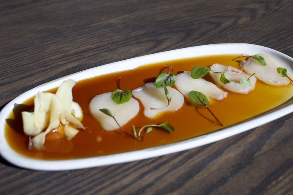 Scallop sashimi is a new dish—part of the raw bar.