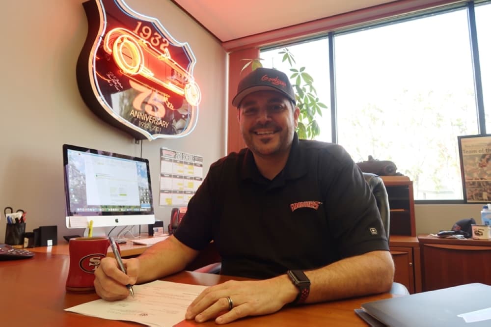 a photo of Andrew Ebel in his office. 