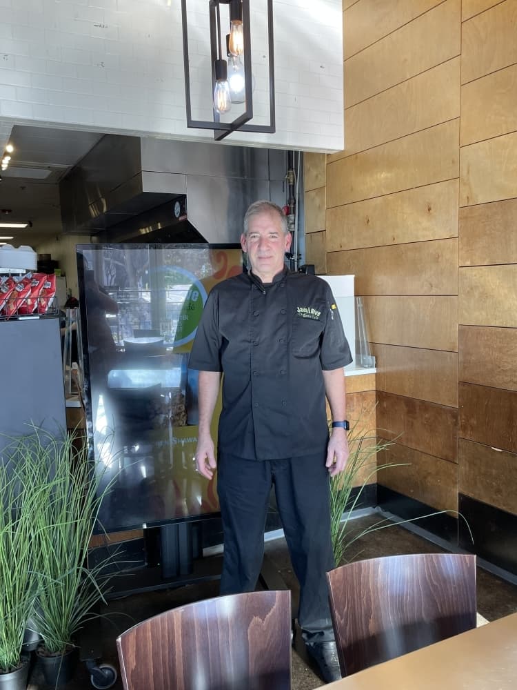 Owner Roni Liberman stands inside his restauraltn