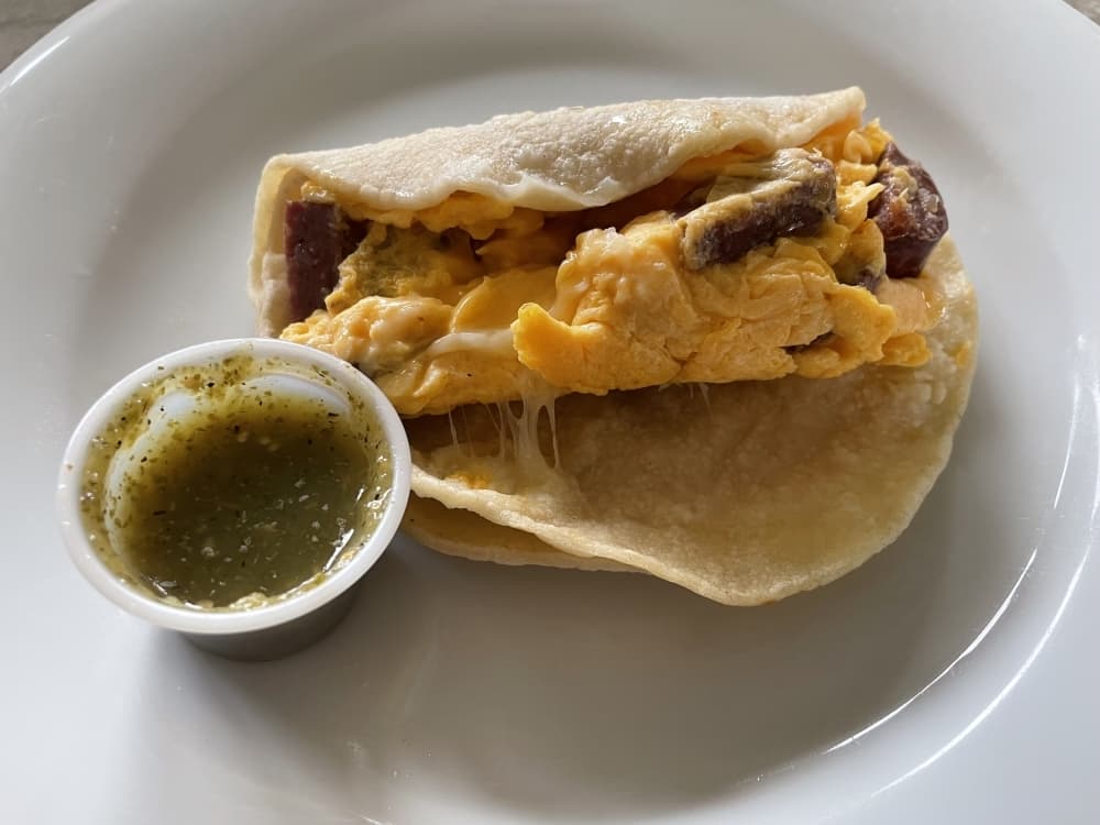 Sausage, egg and cheese breakfast taco.  