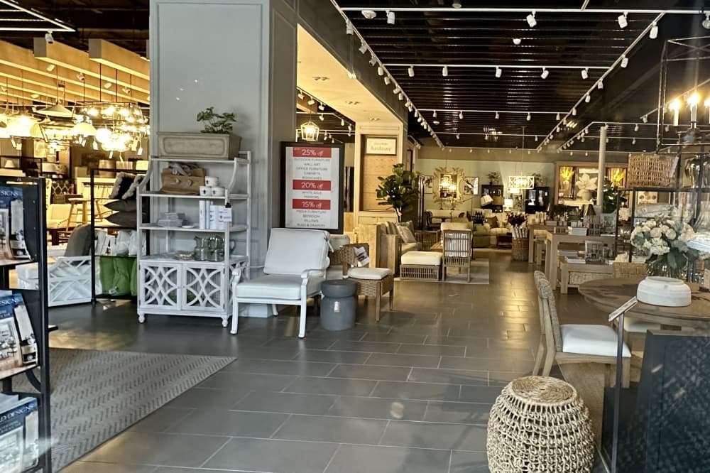 Chairs, stools, sofas, and shelves in a store. 