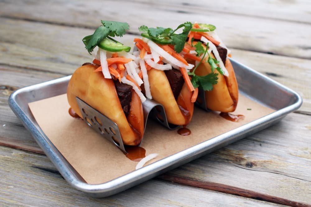 Farm   Feed's menu offers a range of options including Baowser Sliders, which feature beef brisket and several toppings. ($11.75) (Karen Chaney/Community Impact)
