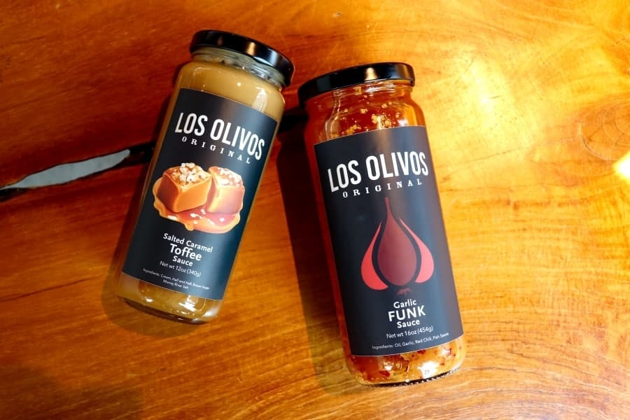 One of Rebecca Varela's favorite items is the Garlic Funk Sauce ($12.99), one of many items diners can purchase and take home. (Zara Flores/Community Impact)