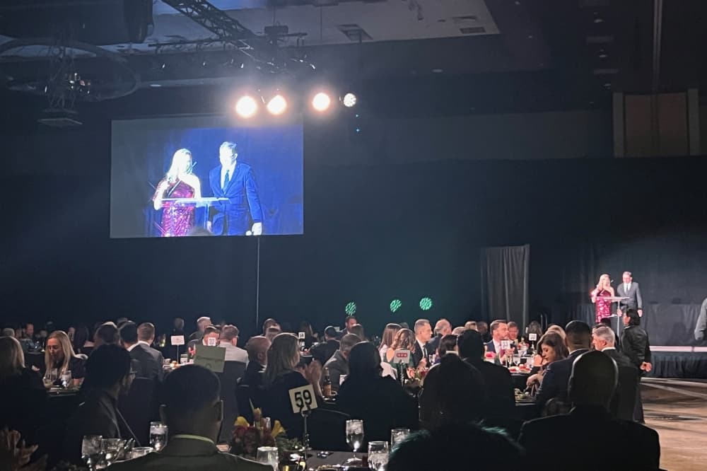 Christal Howard and Tony Felker on stage at the gala
