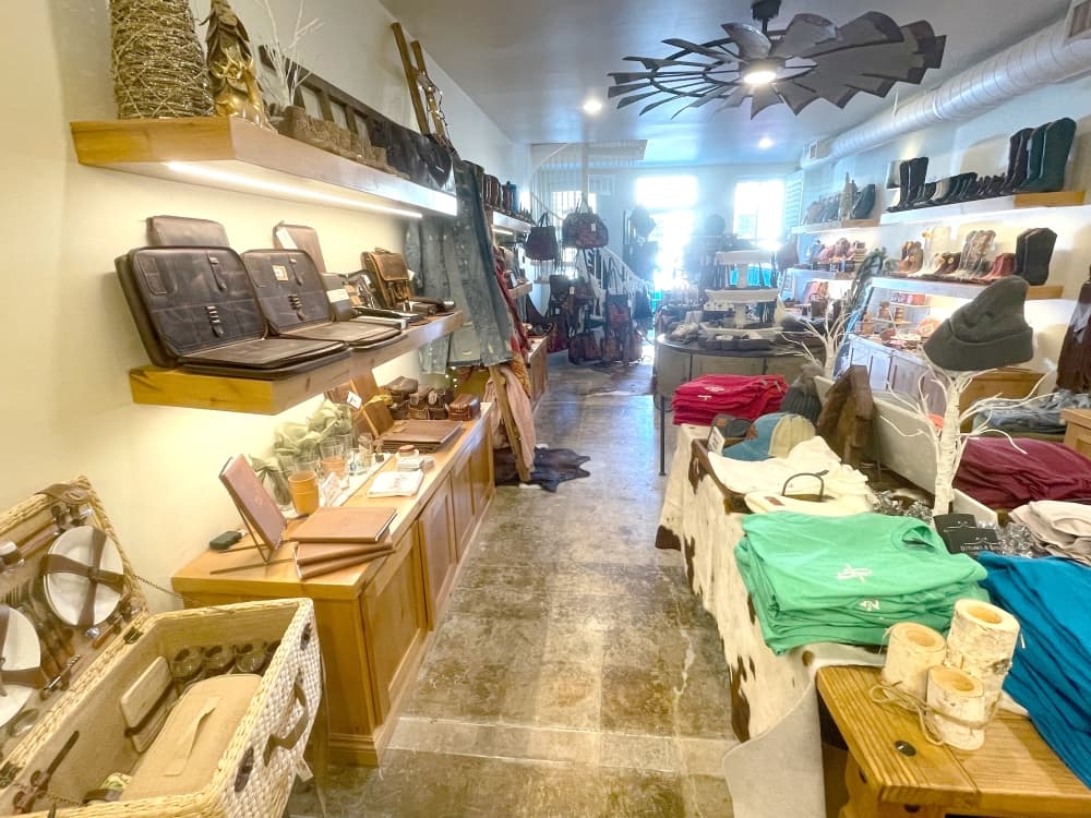 interior of store with clothing and items on shelves