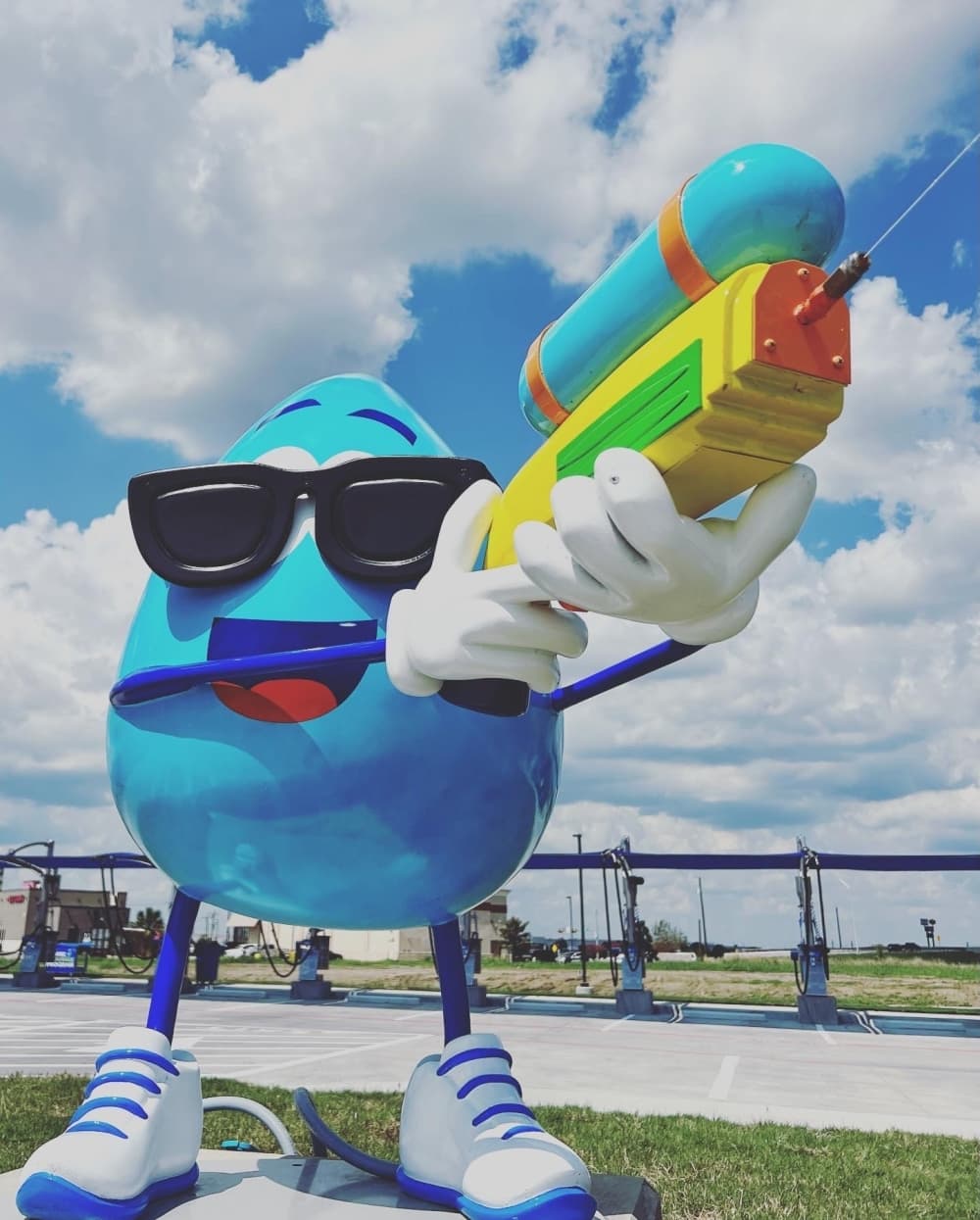 ClearWater Express Wash's mascot, Scrubee, is located at the entrance of the tunnel and shoots water from his water gun onto cars. (Courtesy ClearWater Express Wash)