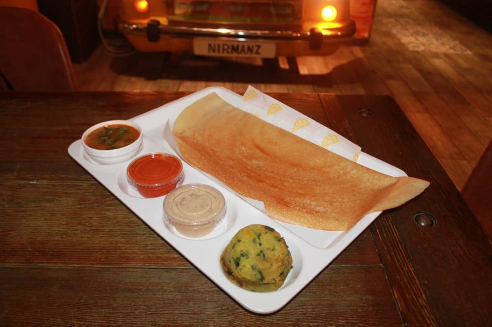 Masala dosa: A crepe is made from fermented rice and lentil and served with a seasoned potato and dry onion curry. (Renee Farmer/Community Impact)