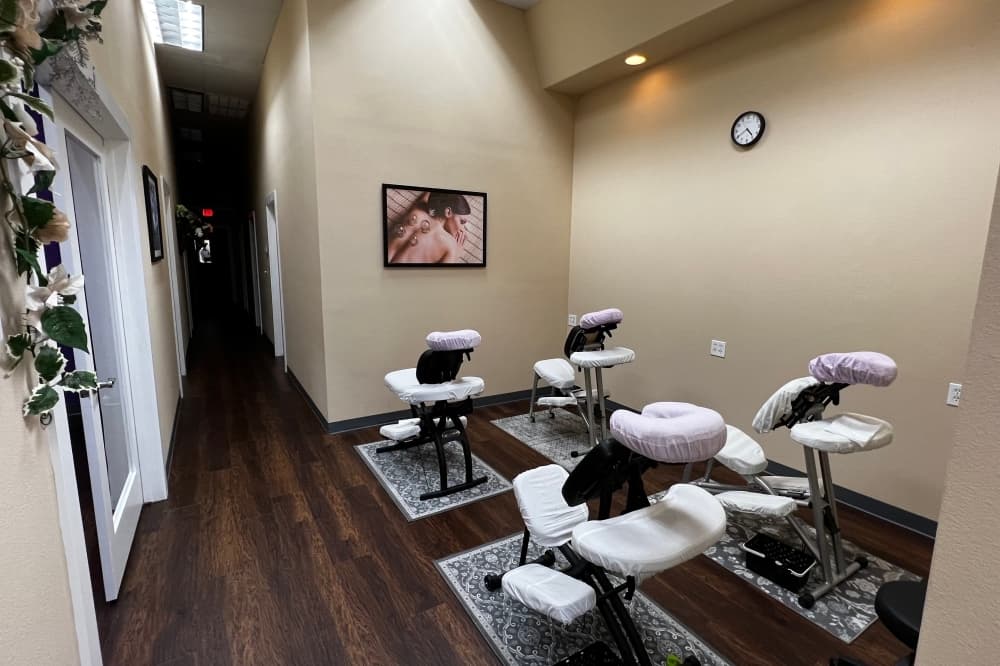 Four massage stations in a room