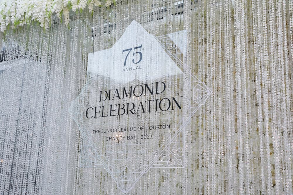 A sign at the Junior League of Houston's annual charity ball reads "Diamond Celebration" and honors the Leagues 75 years in Houston.