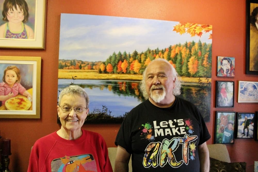 Art assistant Cookie Showalter, left, and owner William Tomkins teach customers how to recreate a painting with step-by-step instructions.