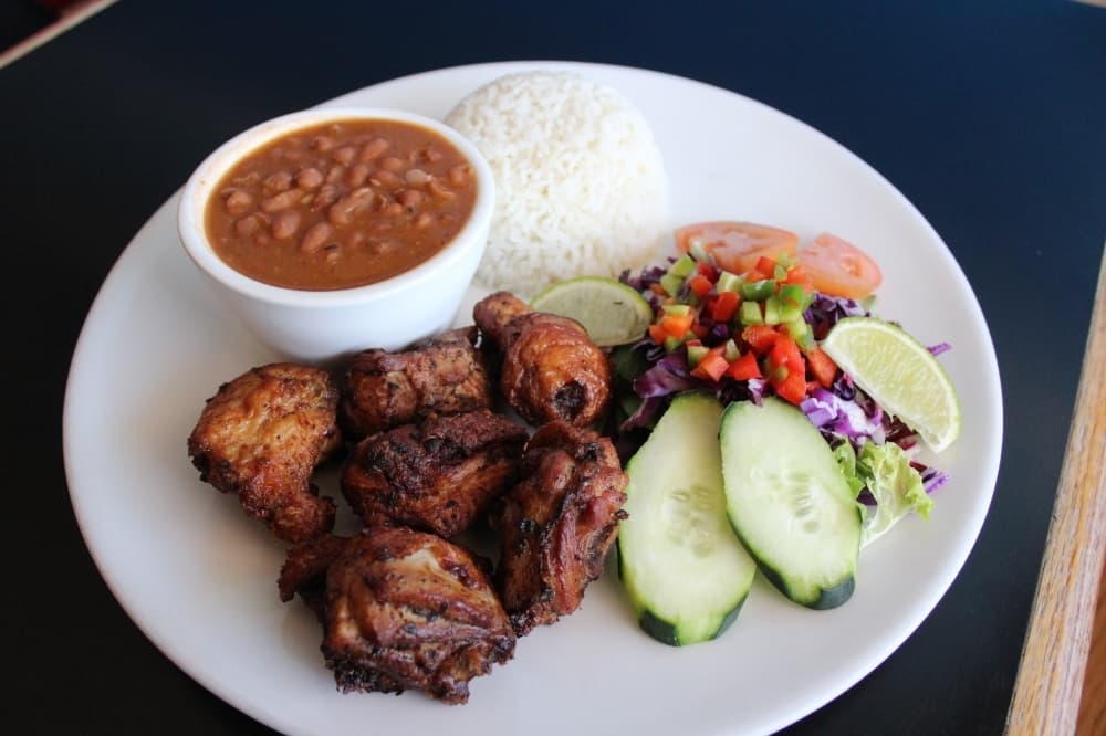 Chicharron de Pollo ($14): Dominican-style fried chicken is served with vegetables, rice and beans.