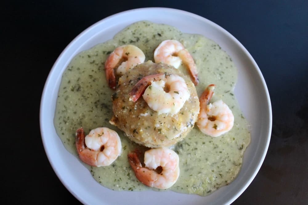 Mofongo Camarones ($17): Fried and mashed green plantains are mixed with olive oil, garlic butter sauce and pork cracklings, and topped with shrimp and garlic sauce. 