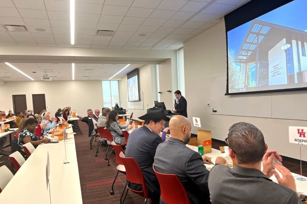 The president and CEO of the Katy Area Chamber of Commerce introduced the guest speakers at the State of Higher Education event held Feb. 16. (Asia Armour/Community Impact)