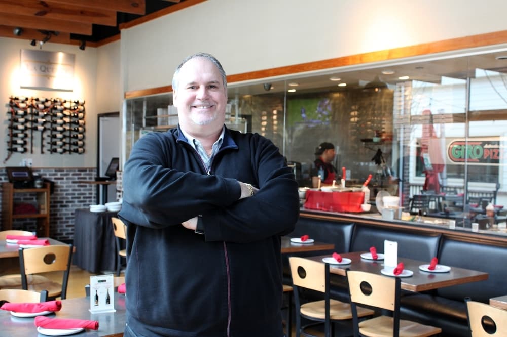a man stands inside a restaurant