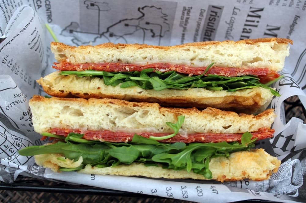 Diavolo is a panini with spicy soppressata, provolone, arugula and oregano on focaccia bread.