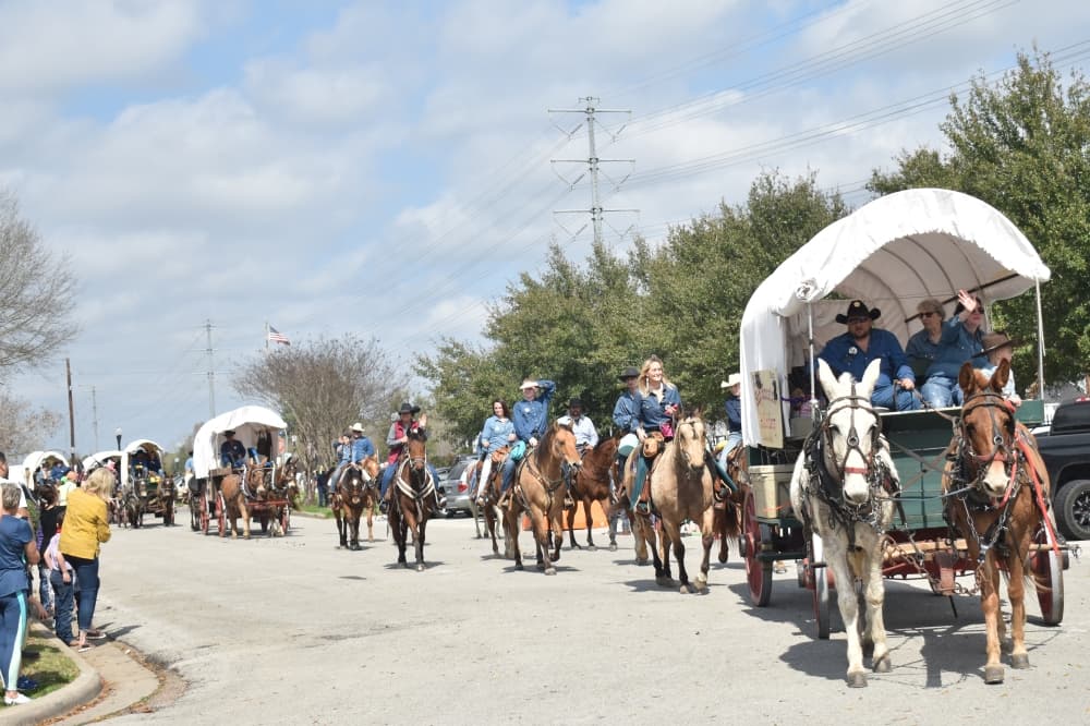 The Sam Houston Trail Riders galloped into Tomball on Feb. 20 as they made their way to the Houston Livestock Show and Rodeo. (Lizzy Spangler/Community Impact)