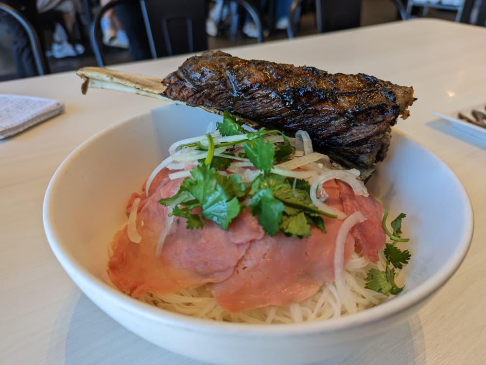 chargrilled beef rib over noodles