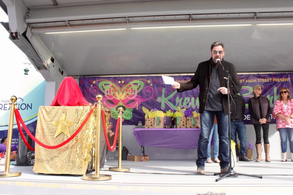 George Fuller on stage talking