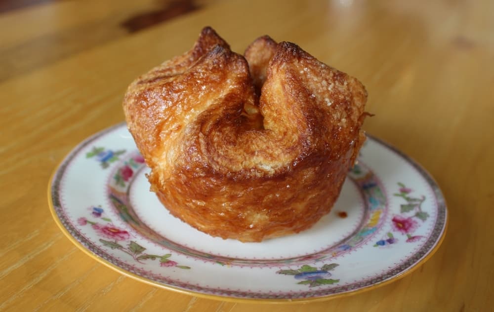 Winter Citrus Kouign Amann ($5.00) A flaky, handmade puff pastry is coated in sugar and filled with pomelo and mango curd. (Karen Chaney/Community Impact)