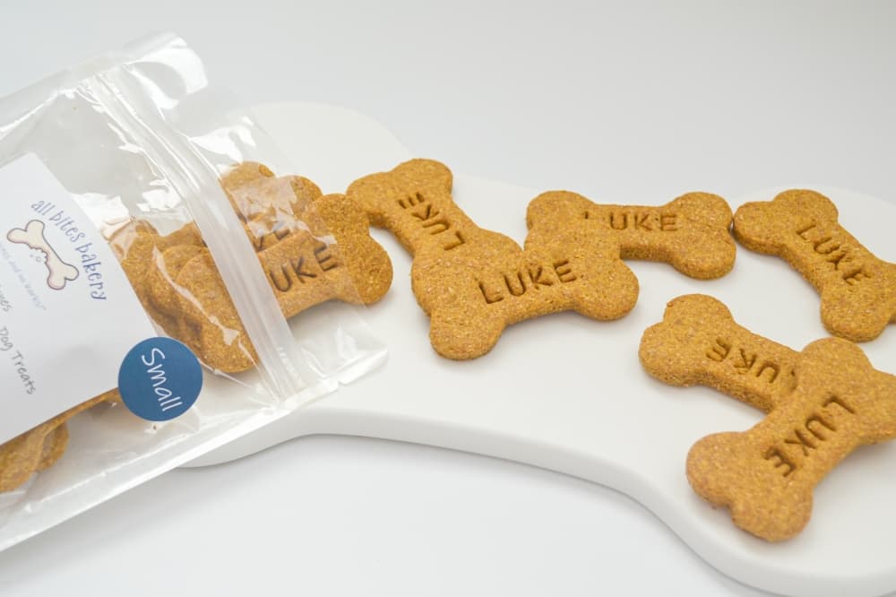 Among All Bites Bakery's offerings are customizable dog treats that can be adorned with a pet's name. (Courtesy All Bites Bakery)