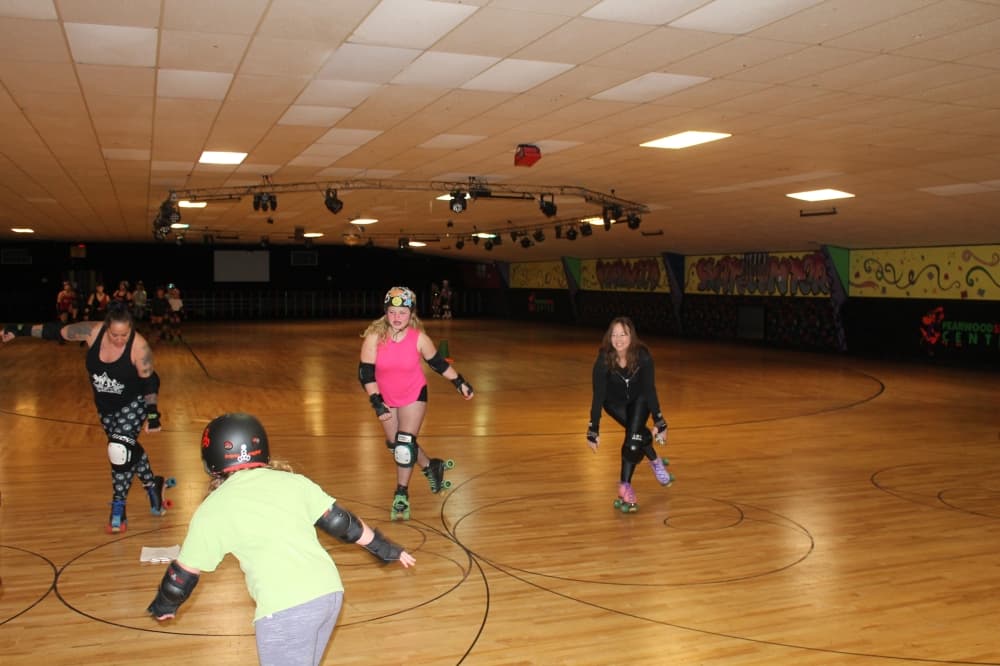 Brenda Holley (far right) founded South Side Roller Derby in 2006. (Sierra Rozen/Community Impact)