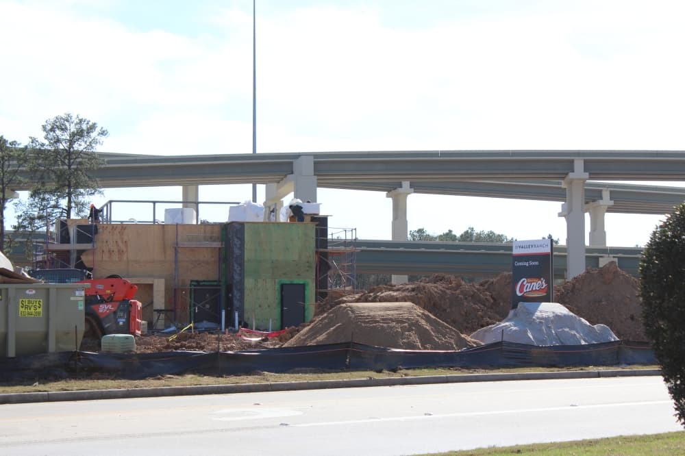 Construction on a Raising Cane's Chicken Fingers location being built in Valley Ranch Town Center began in early November. (Emily Lincke/Community Impact)