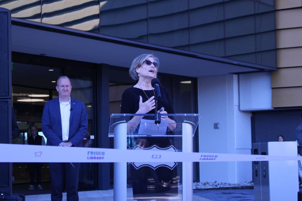 Mayor Jeff Cheney and Frisco Public Library Director Holley Shelley spoke to the crowd before the ribbon cutting ceremony after Deputy City Manager Henry Hill. (Alex Reece/Community Impact)