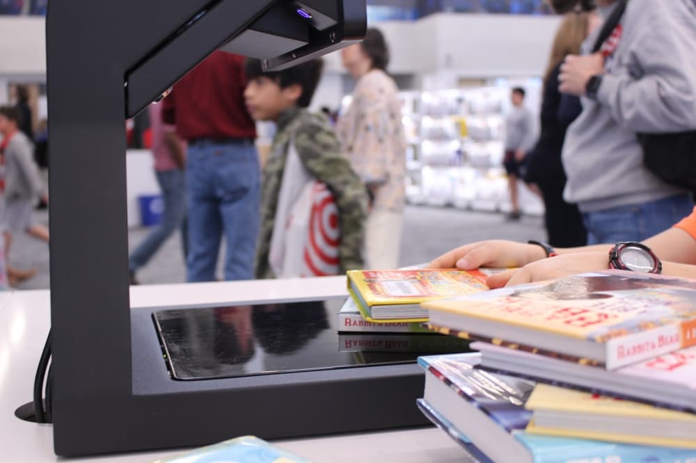 While not all of the library's features were operating, the self-checkout kiosks were available for guests to take books home. (Alex Reece/Community Impact)