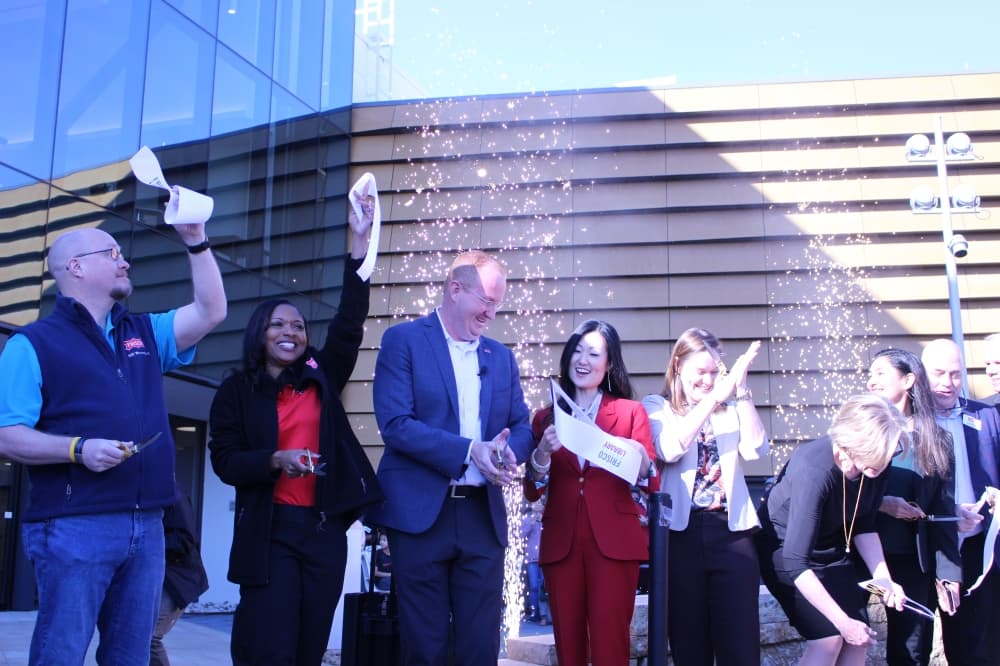 Sparklers burst into the air as Frisco city officials and staff cut the ribbon to the new library, inviting Frisco residents to explore the space for the first time. (Alex Reece/Community Impact)