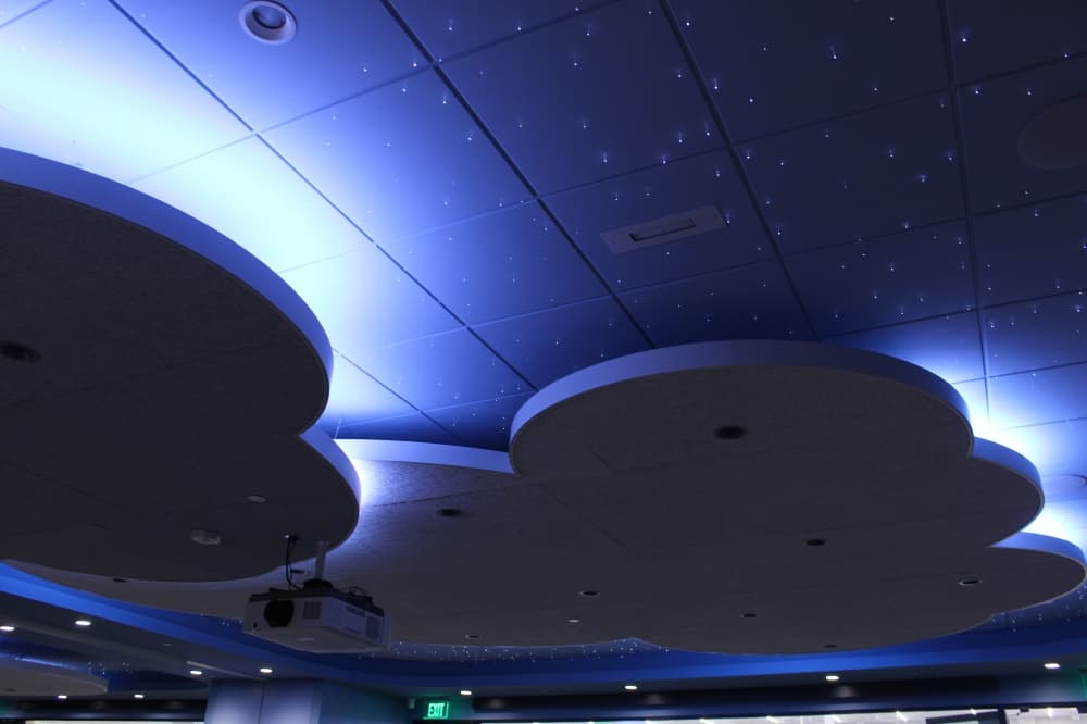 One first floor feature is a nighttime story room, a dim space with illuminated clouds and stars. (Alex Reece/Community Impact)