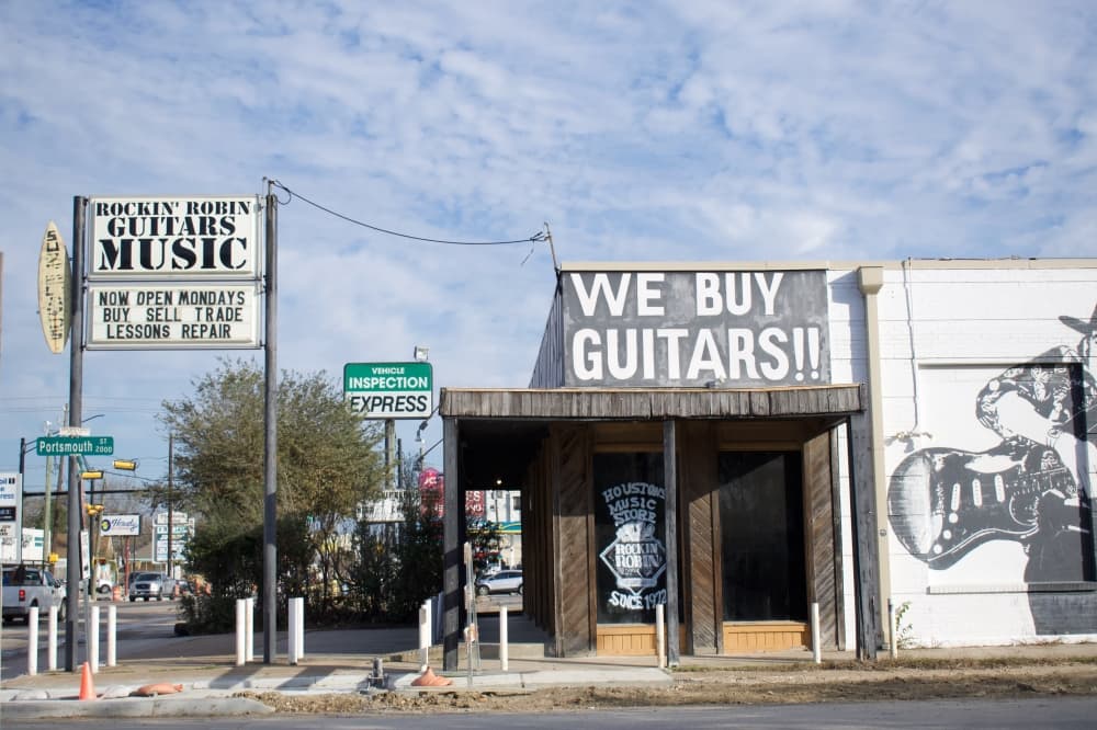 The large "We Buy Guitars" sign marks where Rockin' Robin can be spotted on Shepherd Drive. 