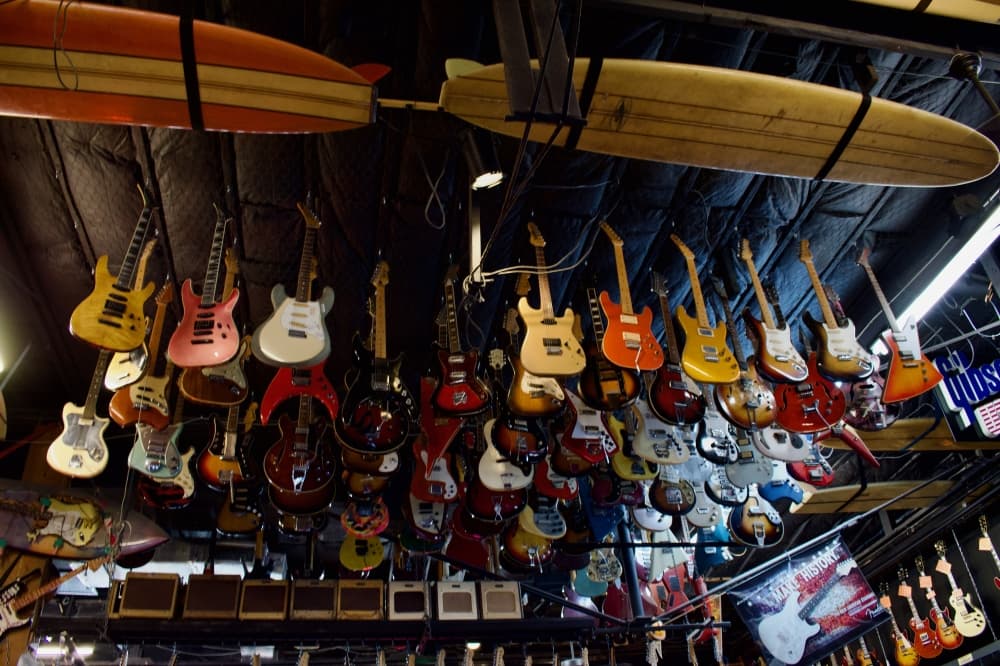 The stock at Rockin' Robin includes acoustic guitars, banjos and ukuleles. (Leah Foreman/Community Impact)