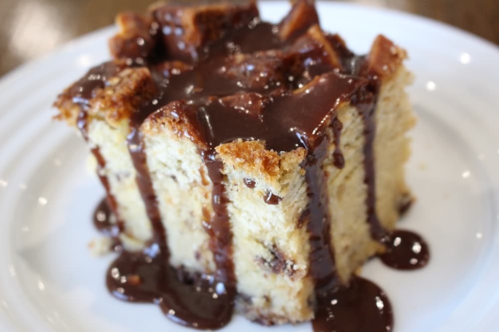 The Coconut Joy (pan: $30-$62; slice: $6) bread pudding is made with coconut flakes, almonds and Callebaut dark chocolate chips. The suggested sauce pairing is the Nutella sauce. (Courtesy Gulf Coast Bread Pudding)