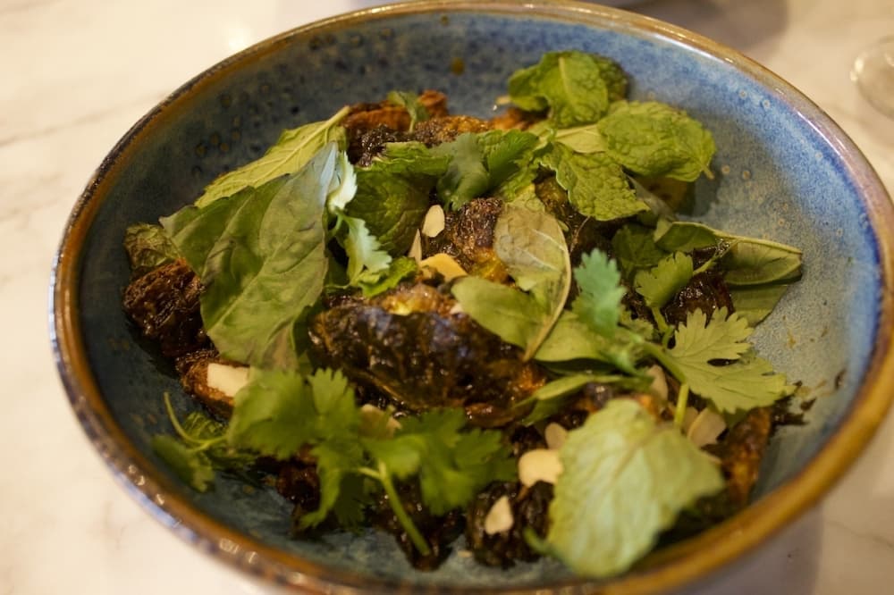 The spicy brussels sprouts are served during dinner with a chili jam, naval orange, almond, garlic and herbs. $14. (Elle Bent/Community Impact)