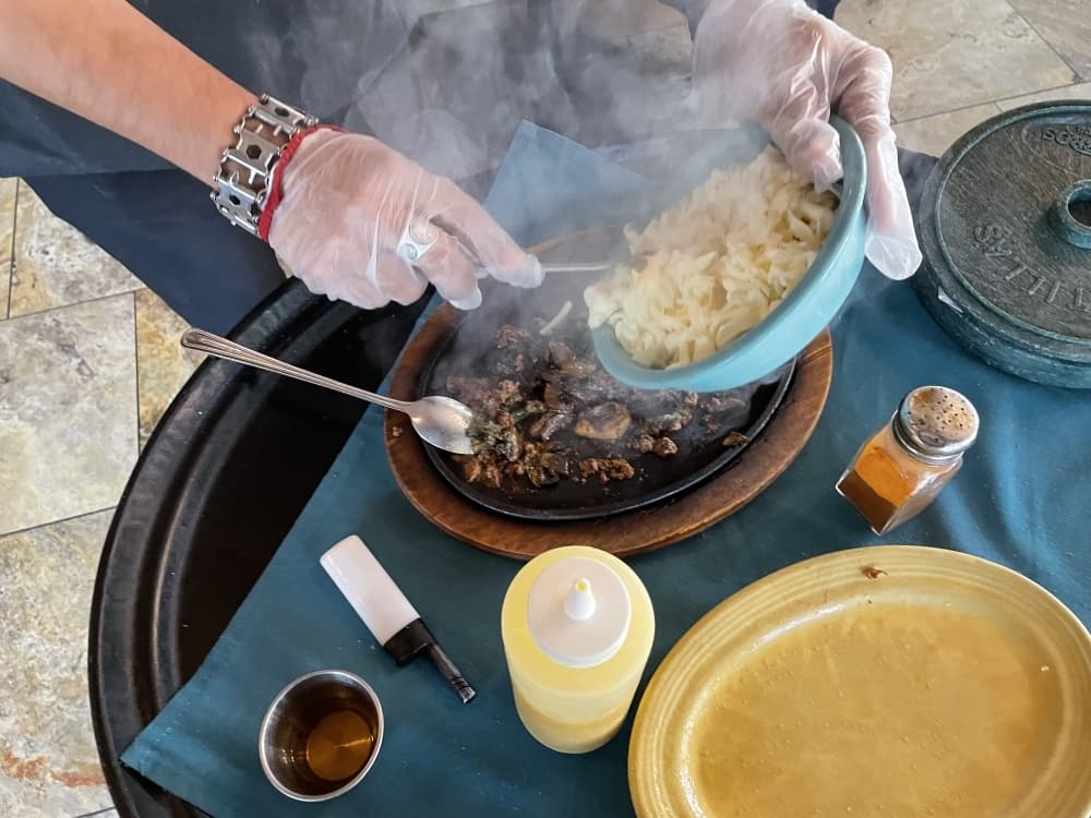 Step 3: Add Monterrey jack cheese to the dish. (Taylor Cripe/Community Impact) 