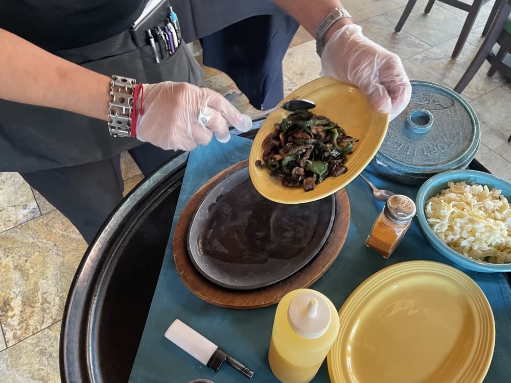 Step 2: Add the Flameado base, which includes mushrooms, roasted poblanos, and chorizo. (Taylor Cripe/Community Impact) 