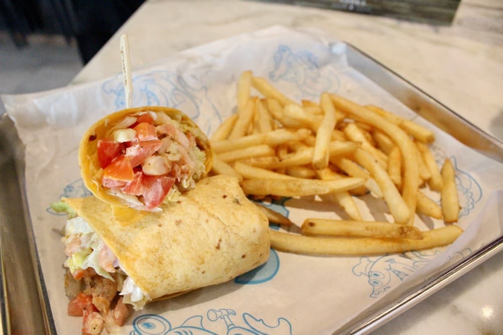 Shrimp wrap ($11.99) Shrimp, cheese, lettuce, tomatoes and garlic Jalapeño ranch dressing rolled in a Jalapeño and cheddar tortilla. Served with fries. (Emily Lincke/Community Impact)