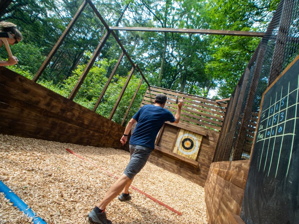 Visitors can participate in outdoor axe throwing. (Courtesy Go Ape Zipline & Adventure Park)