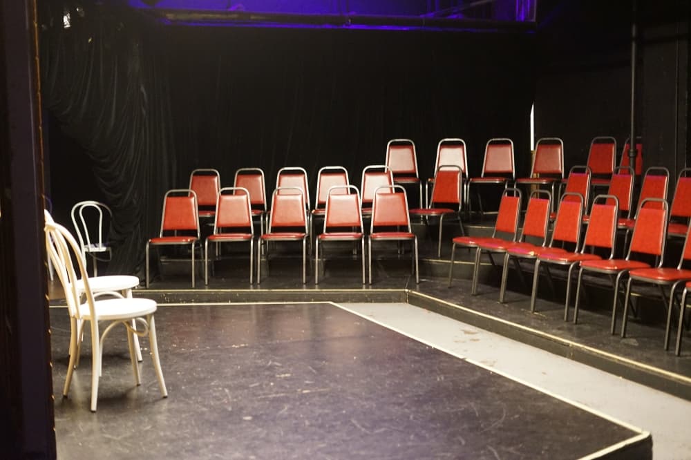 theater with red chairs 