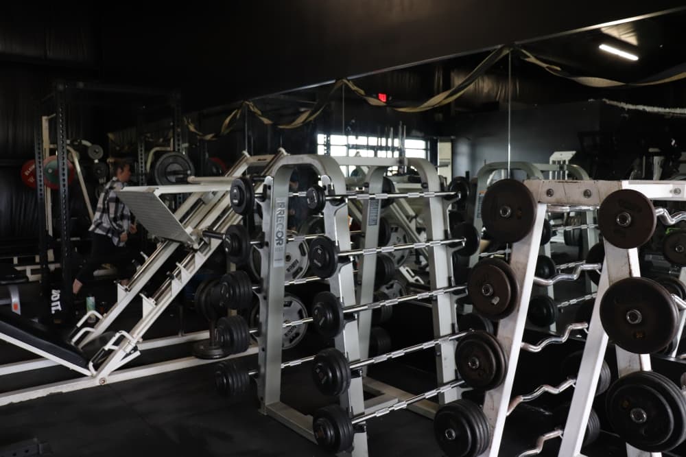 Ghostletics Gym is an open warehouse-style facility with an array of weightlifting equipment. (Zara Flores/Community Impact)