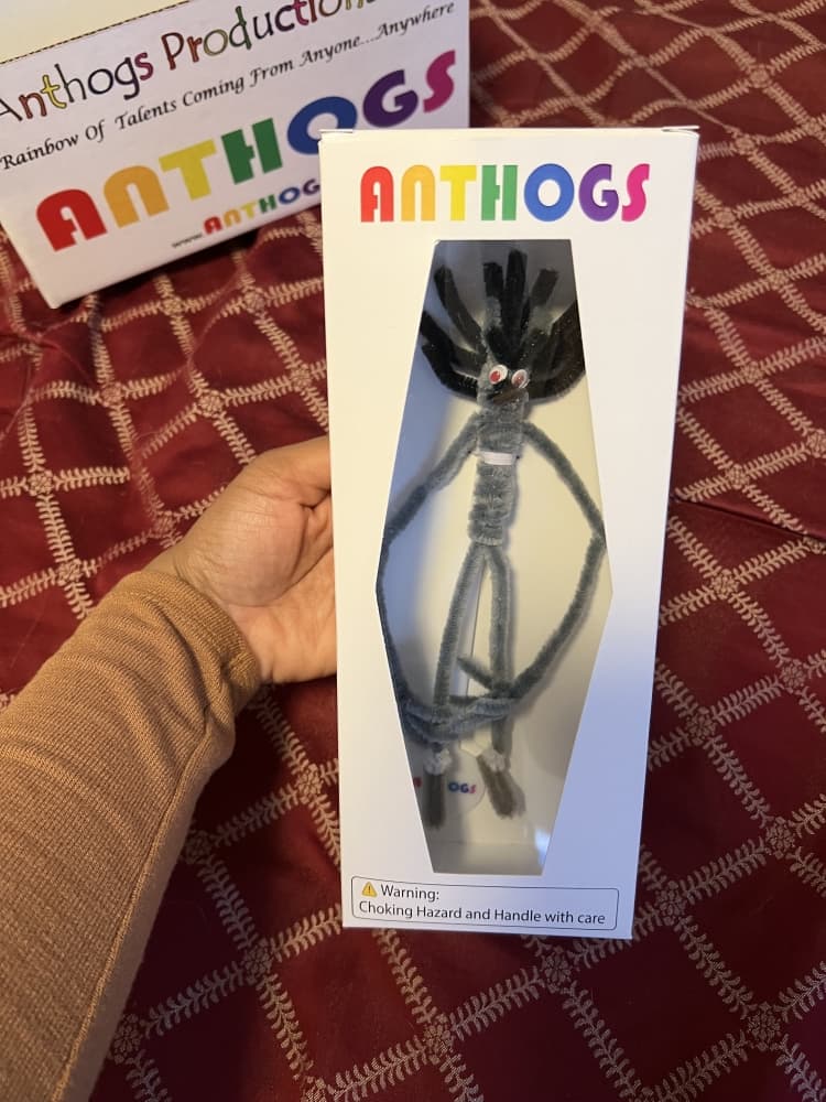 grey pipe cleaner person in white box with anthogs logo