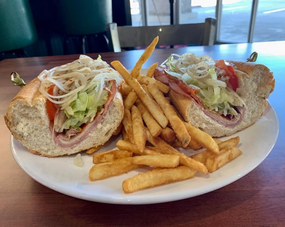 The Italianan Cold Cut Sandwich Combo ($9-$14) includes ham, pepperoni, salami, lettuce, tomatoes and pickled onions on a hoagie with battered fries. (Courtesy Bada Bing Pizzeria)