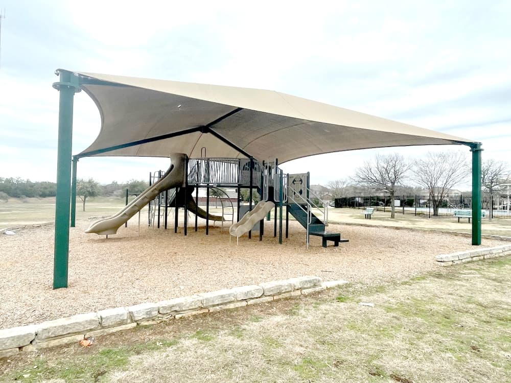 The park has playground equipment, including slides and swings. (Claire Shoop/Community Impact)